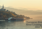 A small river cruise ship gliding along the Danube past a historic European town at golden hour